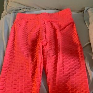 pink leggings. can either be athletic of just regular wearing bottoms